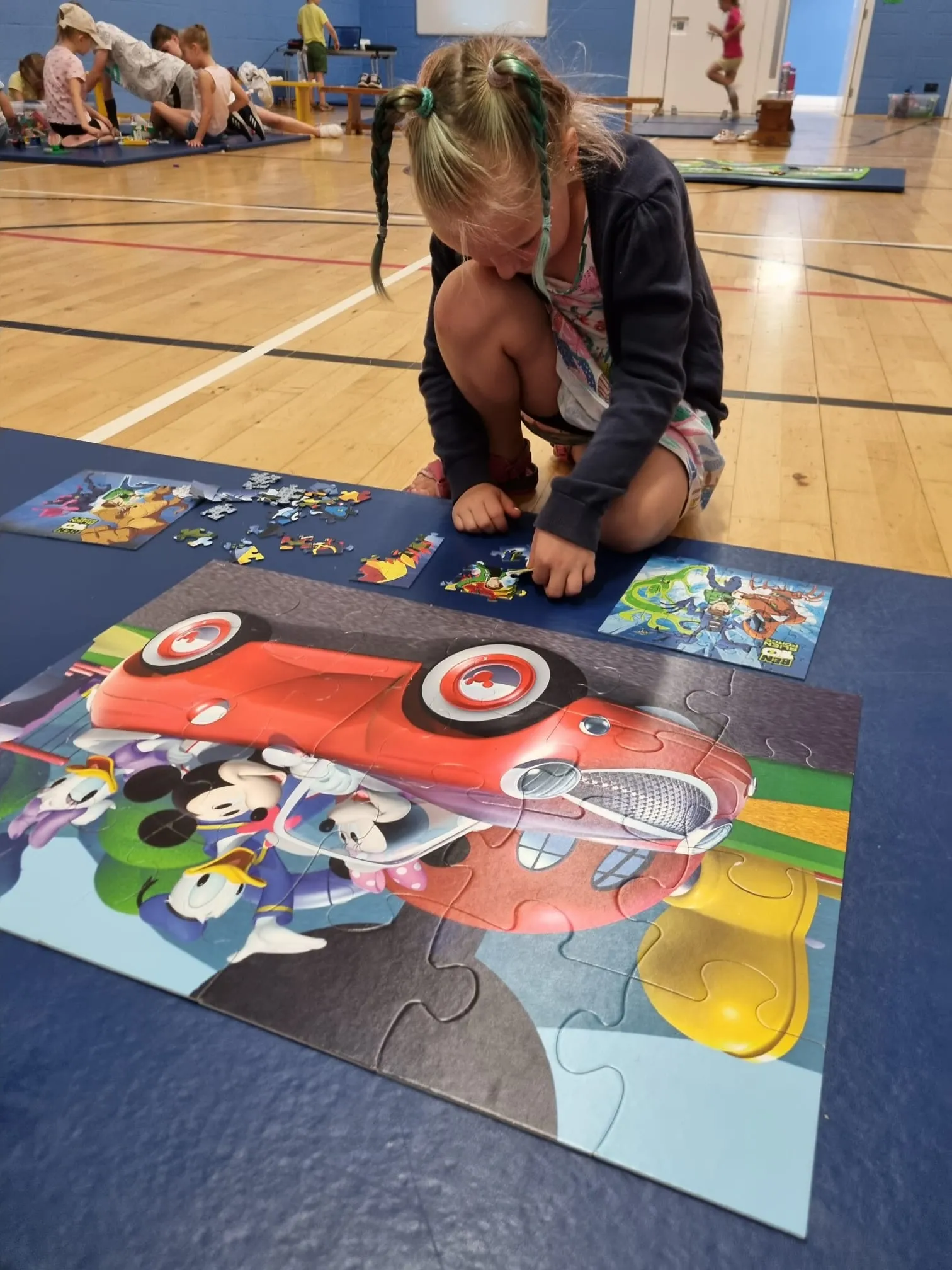 girl completing a puzzle